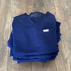 Five Navy blue Fig scrub sets